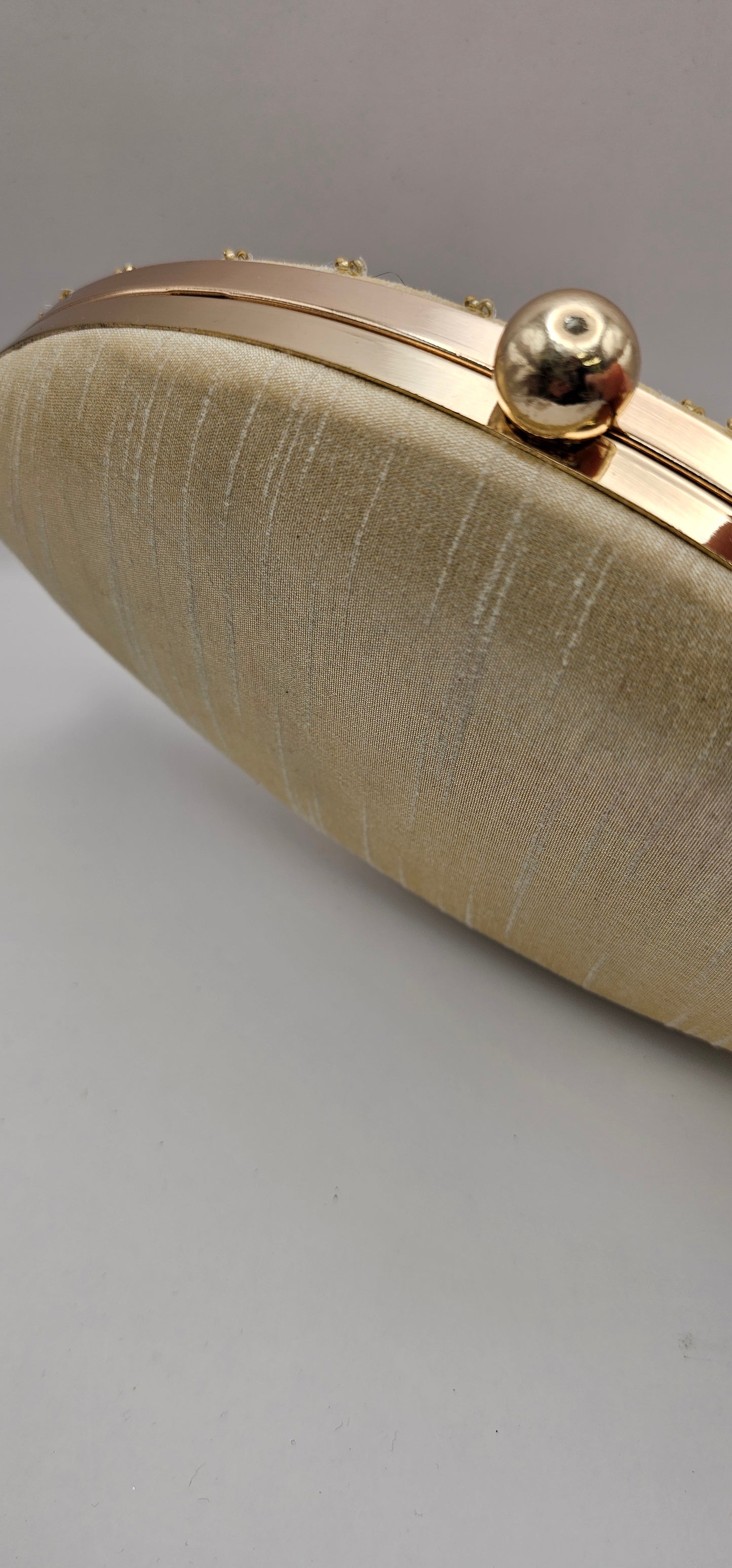 Silk Champagne Coloured Gold Rhinestones, Sequins Oval Shaped Embellished Clutch